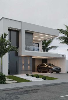 two cars parked in front of a modern house