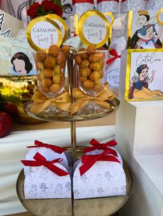 there are two trays with snacks on top of each one, and the other is wrapped in white paper