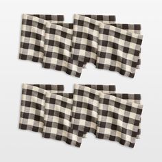 four pieces of black and white checkered fabric