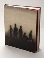 a book with the silhouettes of people standing in front of it on a white surface