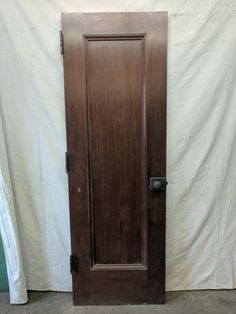 an old wooden door in front of a white backdrop