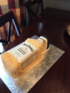 a cake made to look like a stack of books sitting on top of a table