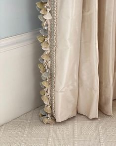 a curtain with shells attached to it