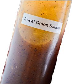 an onion sauce in a glass container with a label on it that says sweet onion sauce