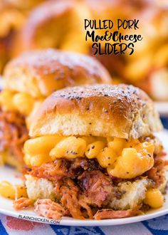 pulled pork cheese sliders on a plate with macaroni and cheese in the background