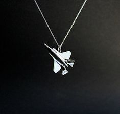 Ever felt the strength of a stealth fighter jet plane? Have you ever heard the sound of the barrier of sound been broken? Thrilling moments that last a lifetime. Imagine having a moment like this always with you, signifying freedom, speed, adventure on a hanging pendant ----Details---- An f35 stealth fighter aircraft for necklace, pin, ring from solid sterling silver, hand carved, using the lost wax method. in the photos you see a glossy top with matte belly f35. Size: 35mm/1.37 inch high Width: Aviation Jewelry, Airplane Jewelry, Sci Fi Jewelry, Pin Ring, Stealth Fighter, Dove Necklace, Father Gift, Jet Plane, Bird Necklace