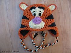 a crocheted hat with a tiger on it