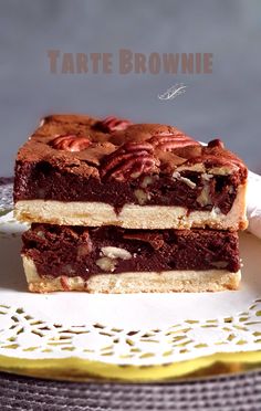 two pieces of cake sitting on top of a white plate