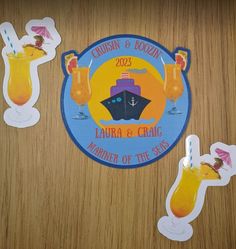 three stickers on a table that include drinks and an image of a cruise ship