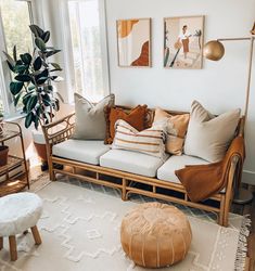 a living room filled with lots of furniture and decor on top of a white rug