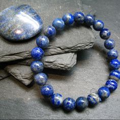 You Are Bidding On A Genuine Lapis Lazuli Bracelet Made With 100% Natural Stones. The Beads Are Round And Strung On A Top Quality Elastic. They Measures 8mm In Diameter. We Make All The Bracelets Ourselves In Pennsylvania, Usa. Blue Beaded Bracelets With Stones, Blue Crystal Bracelet With Stones For Gift, Blue Stone Bracelet For Gift, Blue Crystal Bracelet With Stones As A Gift, Spiritual Blue Beaded Bracelets With Stones, Blue Spiritual Beaded Bracelets With Stones, Blue Crystal Bracelet Gift, Gift Lapis Lazuli Round Bead Bracelets, Natural Lapis Lazuli Bracelets