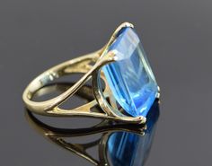 "This is a 10K YG.London blue topaz ring large stone app 18 x 13 mm, Emerald Cut stone, Carribean blue, sits 1/2\" off finger, split shank, high polish,modern, weight 7.9 grams, ring size 6 3/4, spp. 25 ct. Stock # BB75R15" Cubic Zirconia Engagement Rings, Wedding Accessory, Bangles Jewelry Designs, Golden Ring, Ring Emerald, Bridal Bracelet, Thanksgiving Gift, Boston Ma