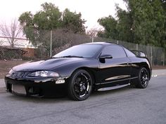 a black sports car parked on the street