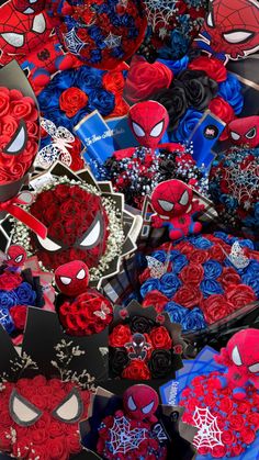 many different types of spiderman decorations on display