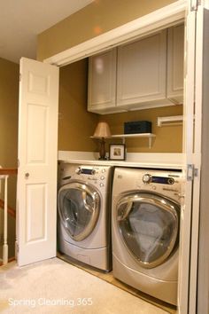 a washer and dryer in a small room