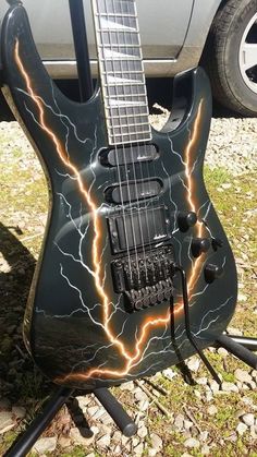 an electric guitar with lightning painted on it