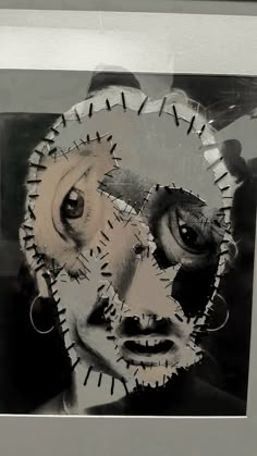 an altered photograph of a woman's face with gears in the shape of her eyes