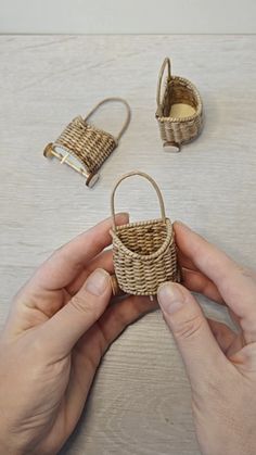 a person is holding some kind of basket in their hand and it's made out of wicker