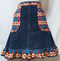 a women's denim skirt with multicolored designs on the front and back