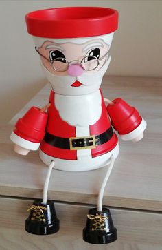 a plastic santa clause figure is standing on its legs