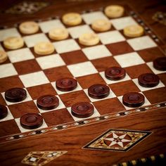 a wooden chess board with buttons on it