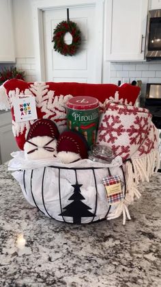 a basket filled with christmas items sitting on top of a counter