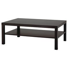 a black coffee table sitting on top of a white floor