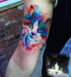 a colorful cat tattoo on the arm and an image of a cat's face