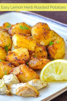 fried potatoes with lemon and parsley on a white plate