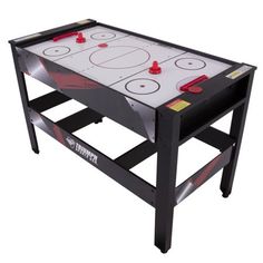 the air hockey table has two red cups on it and is ready to be played