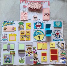 various stickers and magnets laid out on a bed