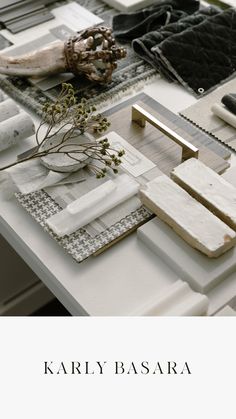 a white table topped with lots of different items