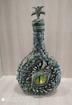 a decorative vase with an eye in the center