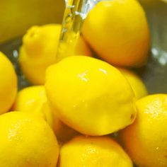 a bunch of lemons that are in a bowl