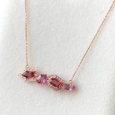 * Main stone :    Natural Untreated Pink & Orange Spinel    4 Pcs. Total weight of 2 ct. * Setting stone : Natural Diamond 0.25 ct * Material : 18Kt Rose Gold * Length of chain : 16 inches  * Width of chain : 1 mm * Pendant Dimensions : 31 x 8 x 5.1 mm Fine Jewelry Rose Gold Necklace With Gemstone Accents, Fine Jewelry Rose Gold Necklaces With Gemstone Accents, Rose Gold Necklace With Gemstone Accents, Sterling Silver Midi Rings, Midi Rings Silver, Pink Garnet, Necklace With Diamond, Duplex Design, Pretty Accessories