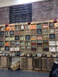 the inside of a store filled with lots of bottles and shelves full of food items