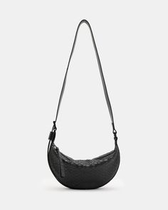 An essential shape – this is the Half Moon Crossbody Bag. It's crafted from leather with a snakeskin finish and shaped to a compact crescent silhouette with plenty of space on the inside. The adjustable strap makes it super easy to wear.  Zip closure Adjustable strap Metal hardware Two interior pockets Will fit the largest size iPhone – please check measurements Black Leather Crossbody Bag, Baby Slippers, Leather Trainers, Gunmetal Grey, Luxury Watches For Men, Black Cross Body Bag, Women Accessories Bags, Green Bag, All Saints