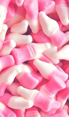 pink and white candies are piled together