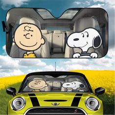 the back window of a car with cartoon characters on it and an image of a dog driving