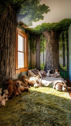 there are many stuffed animals under the tree in this children's room, and it looks like they have fallen asleep