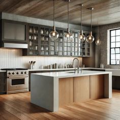 a modern kitchen with wooden floors and stainless steel appliances, including an island countertop