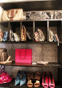 a closet filled with lots of purses and shoes