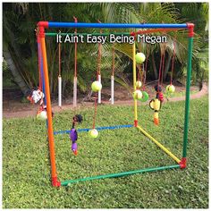 an outdoor play set with balls and ladders