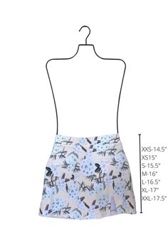 The perfect way to add a little extra coverage without sacrificing an ounce of style! This floral high-waisted swim skirt offers modest booty coverage and a thick elastic waistband that keeps everything perfectly in place. The white women's swim skirt is perfect for any occasion! We love this subtle floral that pairs perfectly with almost any color. An underwear style liner is built in, so you can wear it on its own or over another suit. The first model pairs it with our Agave One Piece ... Swim Skirt With Built-in Shorts And Flowy Fit, Flowy Swim Skirt With Built-in Shorts, Flowy Swim Skirt With Elastic Waistband, Spring Swim Skirt With Built-in Shorts, Lined Swim Skirt For Spring, Spring Skirted Swim Skirt With Lining, Flowy Lined Swim Skirt, Short Length, Spring Lined Swim Skirt, Spring Flowy Lined Swim Skirt