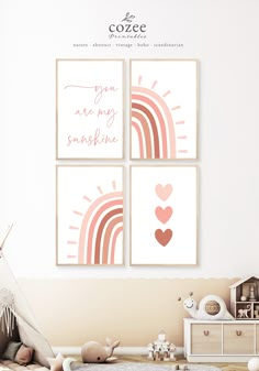 three pink and white pictures on the wall in a child's room with a teepee