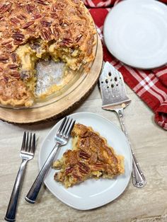 there is a pie on the table with silverware next to it and a fork