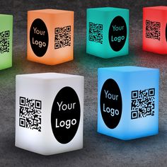 illuminated cubes with qr - code printed on the front and back, all in different colors