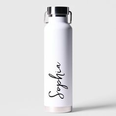 a white water bottle with the word love written in cursive writing on it