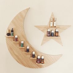 a wooden crescent with bottles on it and a star hanging from the wall behind it