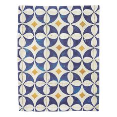 a blue and white tile with circles on it